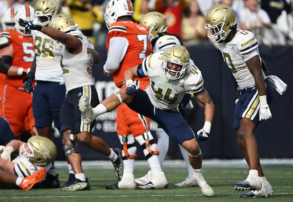 Georgia Tech linebacker Kyle Efford (44) celebrates after sacking Miami quarterback Cam Ward during the second half of an NCAA college football game at Georgia Tech's Bobby Dodd Stadium, Saturday, November 9, 2024, in Atlanta. Georgia Tech won 28-23 over Miami. (Hyosub Shin / AJC)