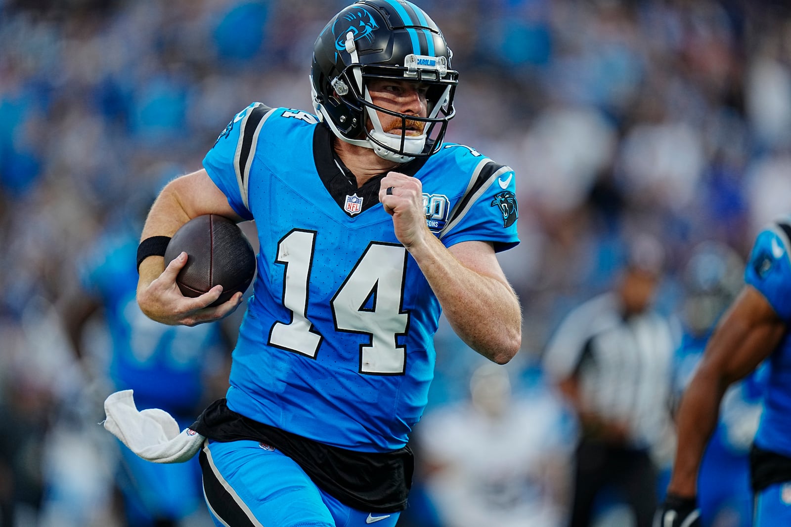 Carolina Panthers quarterback Andy Dalton (14) runs the ball in the first half of an NFL football game against the Atlanta Falcons in Charlotte, N.C., Sunday, Oct. 13, 2024. (AP Photo/Rusty Jones)