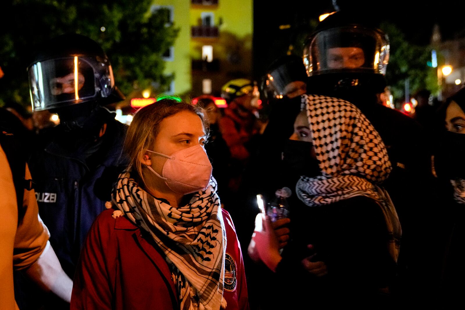 Activist Greta Thunberg, left, attends a pro-Palestinian rally in Berlin, Monday, Oct. 7, 2024. (AP Photo/ Ebrahim Noroozi)