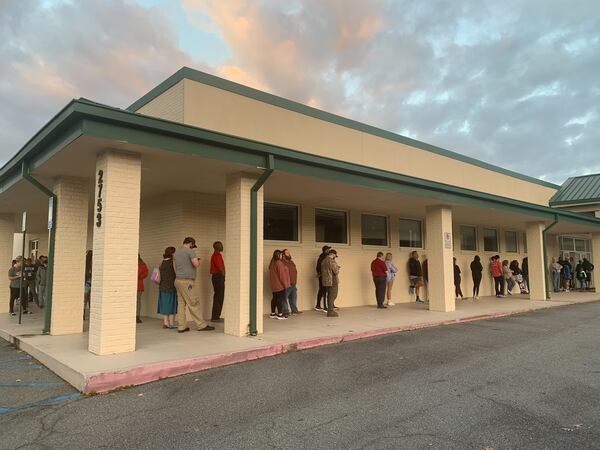 The line wrapped around the building at Ben Robertson Community Center in Kennesaw is moving quickly, with a steady stream of voters adding to it.