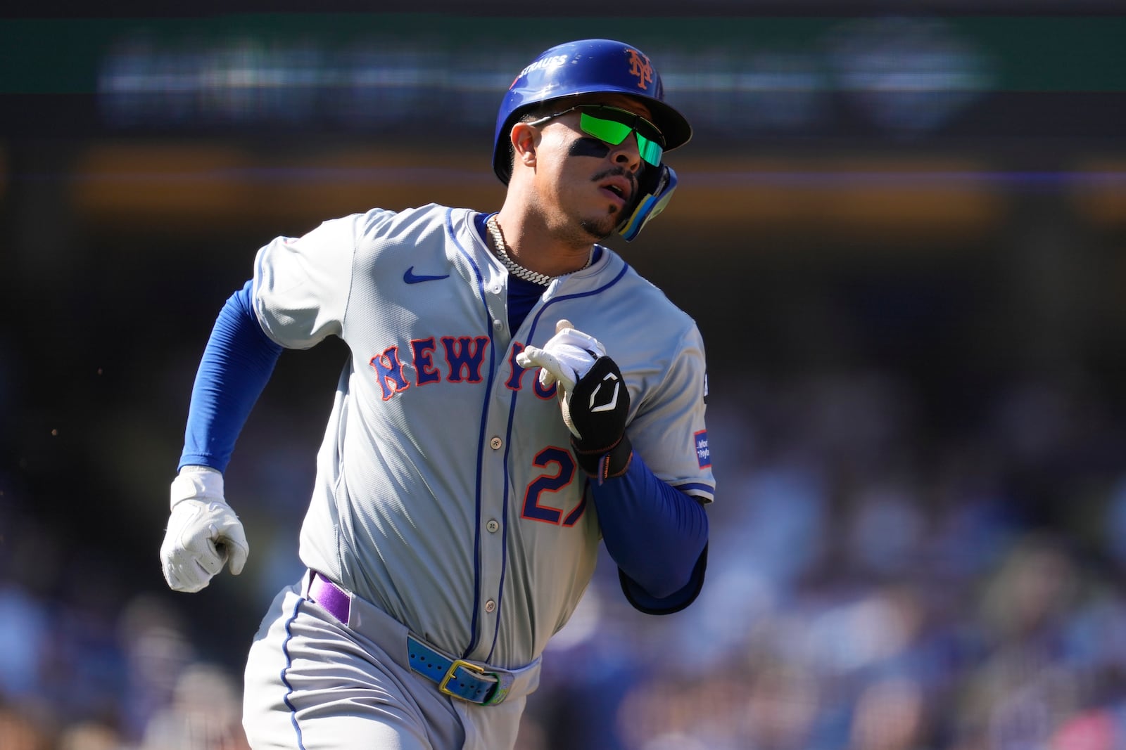 New York Mets' Mark Vientos runs to first base after a single during the fourth inning in Game 2 of a baseball NL Championship Series against the Los Angeles Dodgers, Monday, Oct. 14, 2024, in Los Angeles. (AP Photo/Ashley Landis)