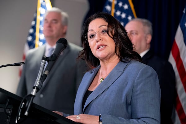 FILE - Rep. Lori Chavez-DeRemer, R-Ore., accompanied by Majority Whip Rep. Tom Emmer, R-Minn., left, and House Majority Leader Rep. Steve Scalise, R-La., right, speaks at a news conference on Capitol Hill in Washington, Jan. 25, 2023. (AP Photo/Andrew Harnik, File)