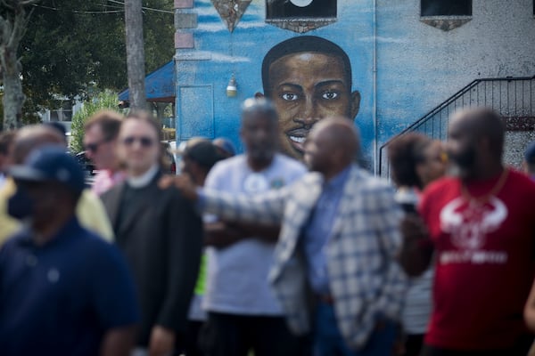 BRUNSWICK, GA - AUGUST, 9, 2022: Friends and family gather near Ahmaud Arbery's mural during an event commemorating his life in downtown Brunswick. (AJC Photo/Stephen B. Morton)