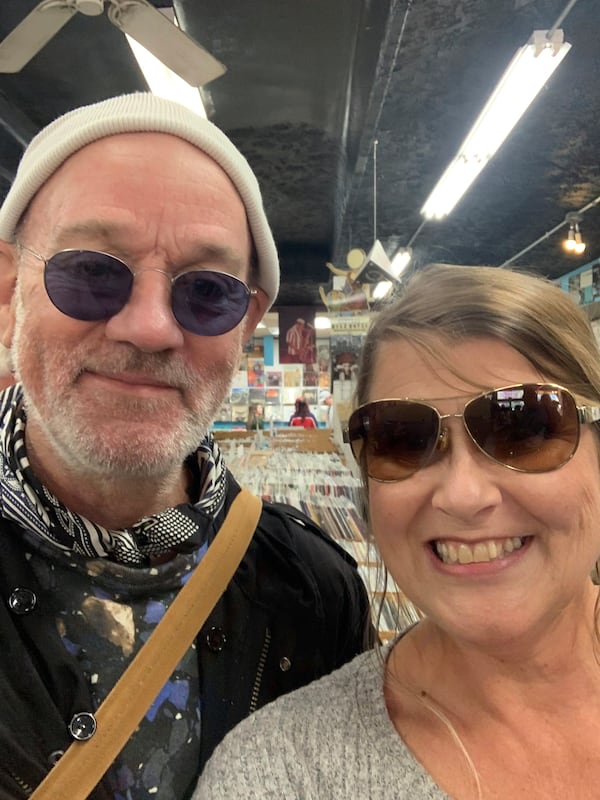 Michael Stipe of R.E.M. Friday Nov. 3, 2023 agreed to a selfie with Hoschton resident Dixie Taylor at Wuxtry Records in Athens. RODNEY HO/rho@ajc.com