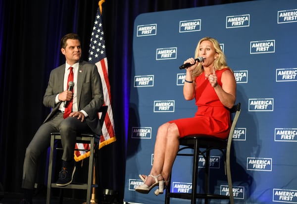 Reps. Matt Gaetz and Marjorie Taylor Greene speak to a crowd of over 200 at the Iowa Events Center in Des Moines as part of their "Put America First" nationwide tour. (Anjali Huynh / Anjali.Huynh@ajc.com)