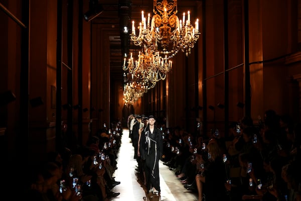 Models wear creations as part of the Dries Van Noten Fall/Winter 2025-2026 Womenswear collection presented in Paris, Wednesday, March 5, 2025. (Photo by Scott A Garfitt/Invision/AP)