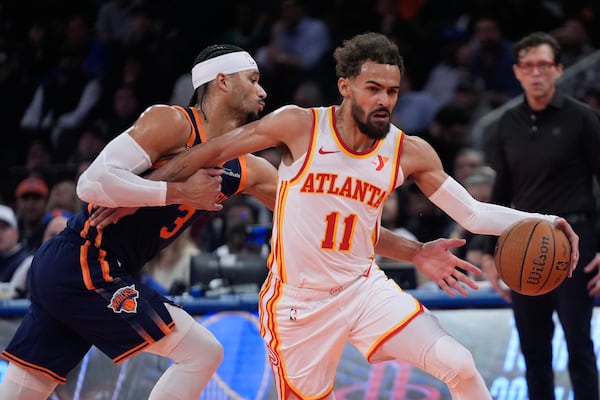 Atlanta Hawks' Trae Young (11) drives past New York Knicks' Josh Hart (3) during the first half of an Emirates NBA Cup basketball game Wednesday, Dec. 11, 2024, in New York. (AP Photo/Frank Franklin II)