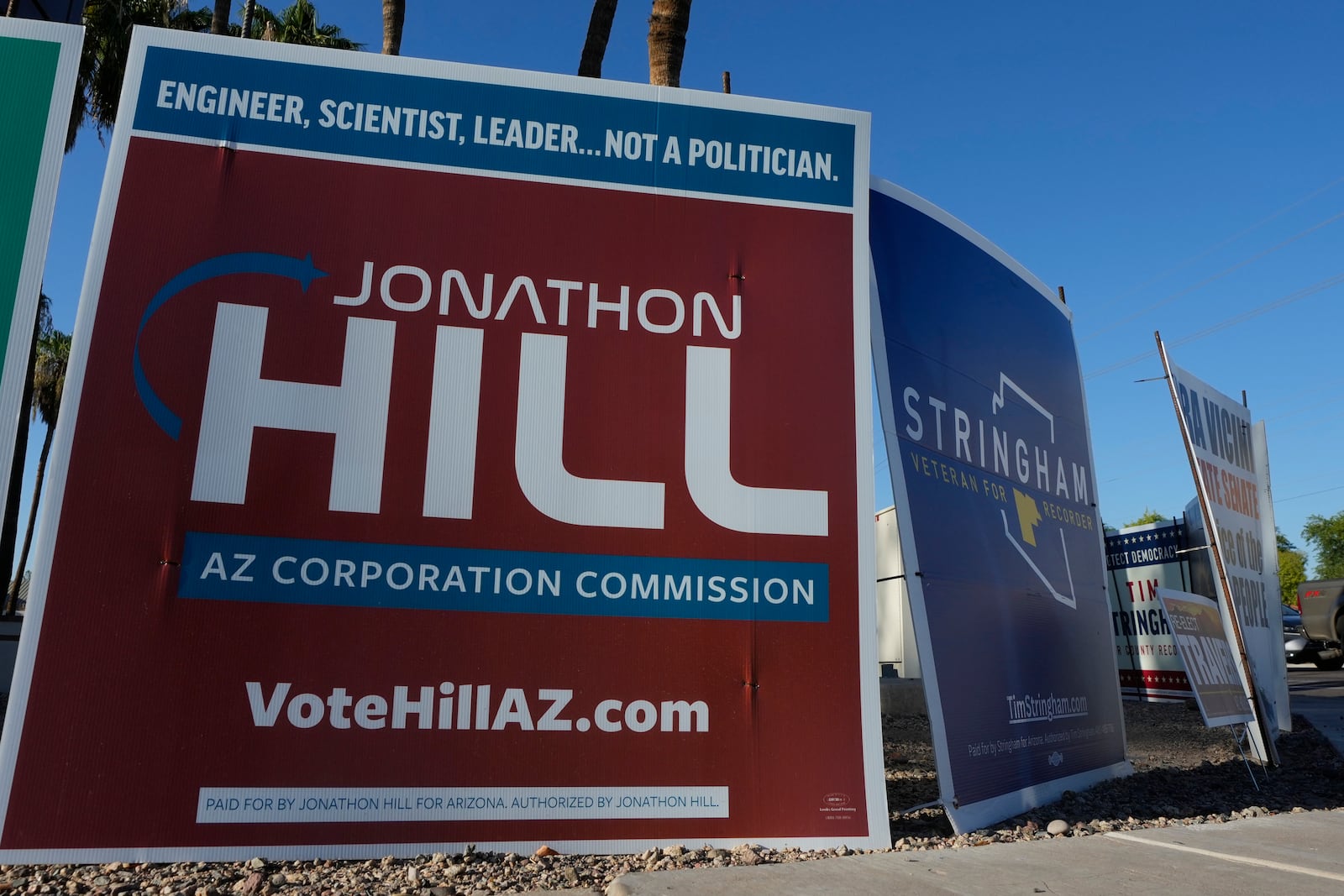 Some of the many political signs on display for the upcoming general election Thursday, Sept. 26, 2024, in Tempe, Ariz. (AP Photo/Ross D. Franklin)