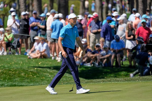 Jordan Spieth walks off the eighth green during the first round of The Players Championship golf tournament Thursday, March 13, 2025, in Ponte Vedra Beach, Fla. (AP Photo/Julia Demaree Nikhinson)