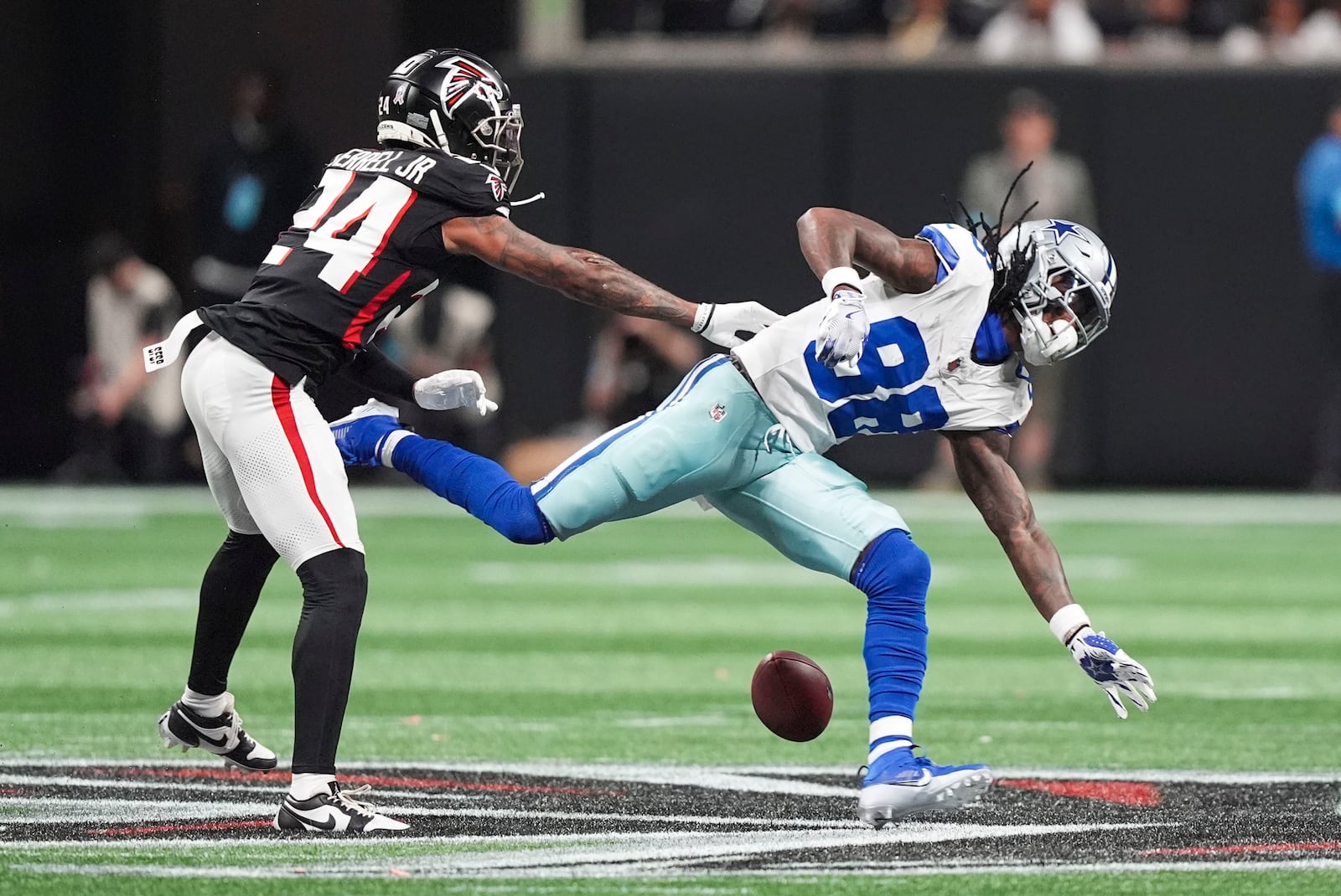 Dallas Cowboys wide receiver CeeDee Lamb (88) drops a pass as he is defended by Atlanta Falcons cornerback A.J. Terrell (24) during the first half of an NFL football game, Sunday, Nov. 3, 2024, in Atlanta. (AP Photo/ Brynn Anderson)