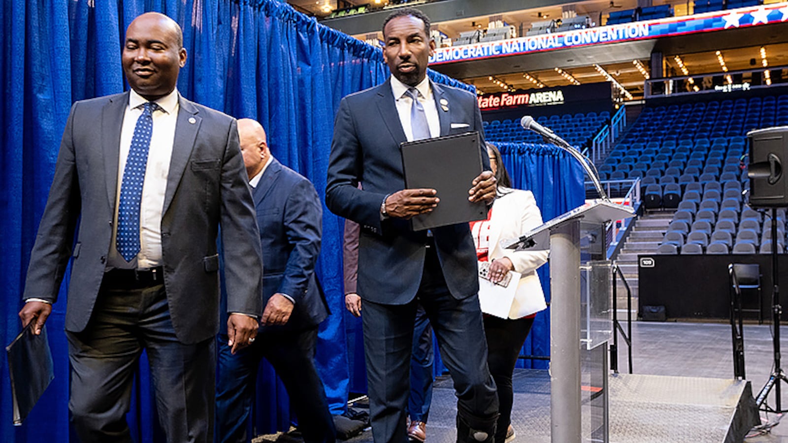 Democratic National Committee Chair Jamie Harrison, left, exits the stage with Atlanta Mayor Andre Dickens after speaking to journalists following a tour of State Farm Arena in July 2022 as part of the evaluation process in selecting a city to host the party's 2024 convention. Chicago got the nod, but Harrison this past week that he wished he could award Atlanta the convention in 2028 or 2032. That will have to be decided later. Ben Gray for The Atlanta Journal-Constitution