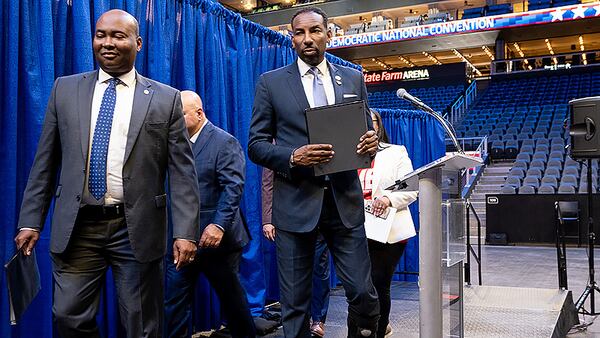 Democratic National Committee Chair Jaime Harrison, left, and Atlanta Mayor Andre Dickens leave a stage after after touring State Farm Arena on July28, 2022, as part of Atlanta’s bid to host the 2024 Democratic National Convention. Ultimately, Chicago won out over Atlanta. (Ben Gray for the Atlanta Journal-Constitution)