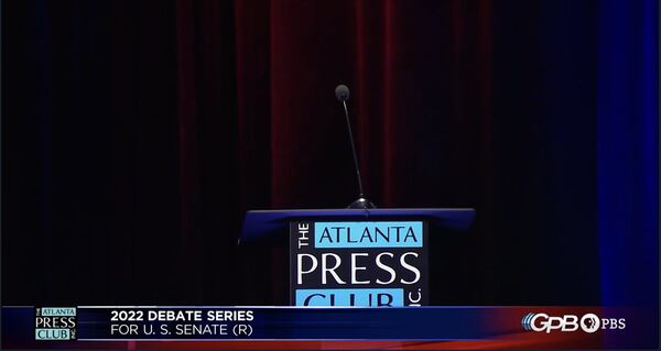 An empty podium represented Herschel Walker, the front-runner in the race for the GOP's U.S. Senate nomination. Walker has limited his public appearances, and Tuesday marked the second time he chose not to attend a debate.