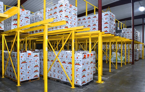 211118 Lake Park, Ga: Boxes of satsumas sit in cold storage awaiting final quality control, bagging and distribution. The AJC visits Corbett Brothers Farms for a story on their satsuma farming operation as part of Georgia's emerging citrus market. Photos for Georgia on My Plate series, 010822satsumafarm. All photos taken Thursday November 18, 2021 in the groves and packaging, shipping facilities of Corbett Brothers Farms 972 GA Hwy 376, Lake Park Ga. 31636. (Chris Hunt for The Atlanta Journal-Constitution)