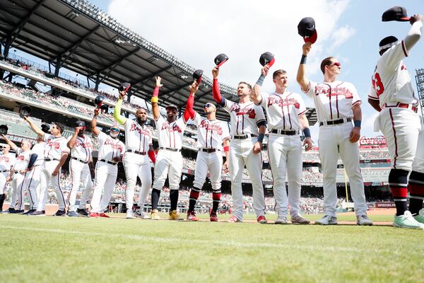 Braves players wave to the fans as the team is being recognized for the number of breaking record season moments before the last game of the season against the Washington Nationals at Truist Park on Sunday, October 1, 2023, in Atlanta.
Miguel Martinez / miguel.martinezjimenez@ajc.com 