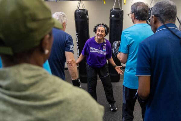 Rock Steady Boxing Instructor Nausheen Quraishy (center) runs a class in which people with Parkinson's exercise and try to regain their strength at the Kennestone Health Place at Kennestone Hospital in Kennesaw. After suffering an AVM rupture 18 years ago, doctors said she had "no reason to be alive and functioning." She used her own personal battles to help her inspire others to fight for their future. PHIL SKINNER FOR THE ATLANTA JOURNAL-CONSTITUTION