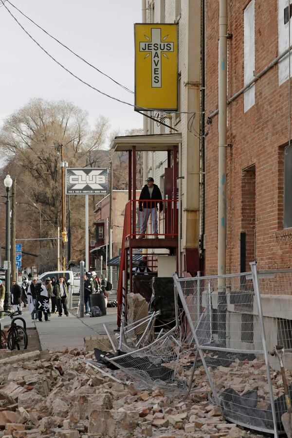 A man looks at the rubble after an earthquake Wednesday in Utah.