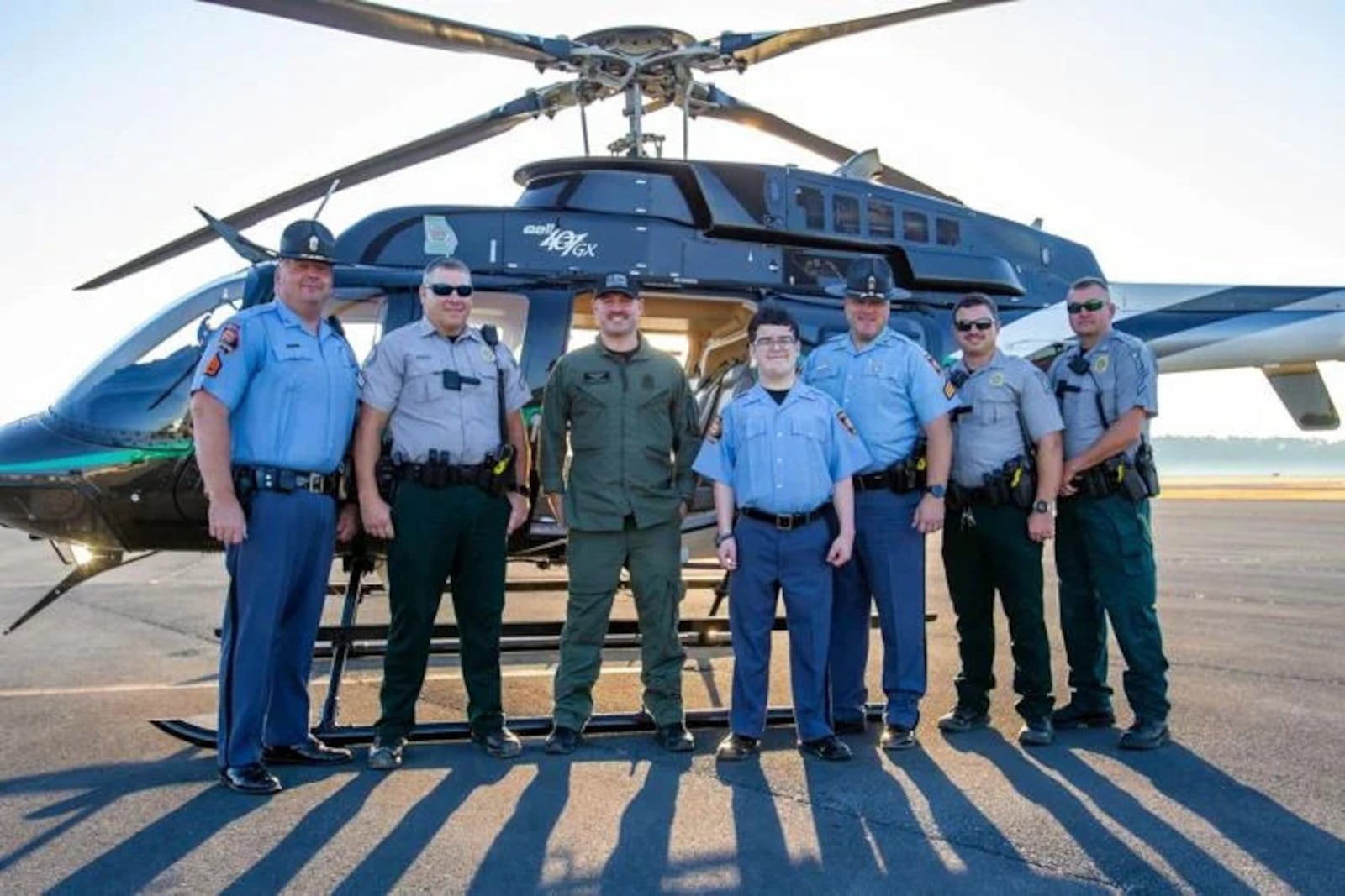 Grant Minton poses with members of the Georgia State Patrol and Georgia Department of Natural Resources before boarding the helicopter and flying to the state Capitol. (Photo Courtesy of Steven Eckhoff)