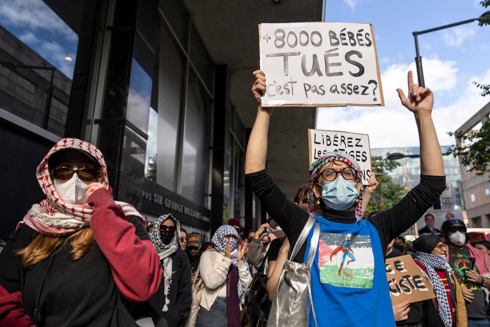 Attendees react during a pro-Palestinian demonstration on the anniversary of a Hamas attack on Israel that triggered the ongoing war in Gaza in front of Concordia University in Montreal, Canada, Monday, Oct. 7, 2024. (Christinne Muschi/The Canadian Press via AP)