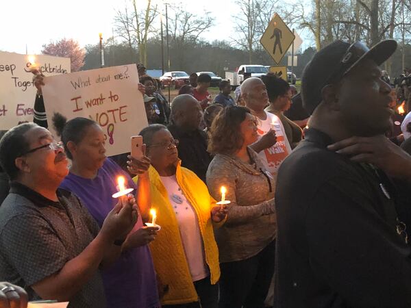 Stockbridge residents attend February candlelight prayer vigil opposing creation of city of Eagle’s Landing. LEON STAFFORD/AJC