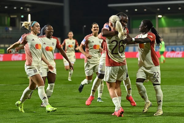 FLIE - Lyon's Lindsey Horan celebrates with teammates after scoring their side's second goal of the game during the Women's Champions League group stage soccer match between VfL Wolfsburg and Olympique Lyon at the AOK Stadion in Wolfsburg, Germany, Thursday Oct. 17, 2024. (Swen Pförtner/dpa via AP, File)