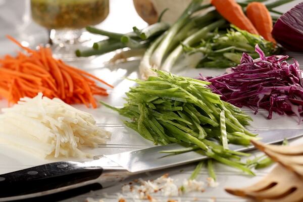 Though most slaws you'll encounter are shredded with a grater or food processor, a sharp knife makes a beautifully thin julienne of myriad vegetables. (Michael Tercha/Chicago Tribune/TNS)