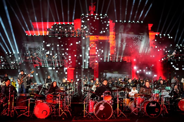 Musicians play on the stage during the concert for freedom for the 35th anniversary of the fall of the Berlin Wall, at the Brandenburg Gate in Berlin, Germany, Saturday, Nov. 9, 2024. (AP Photo/Ebrahim Noroozi)