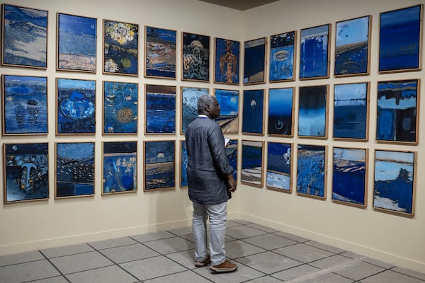 A visitor explores the international exhibit at the Dakar Biennale of Contemporary African Art in Dakar, Senegal, Friday, Nov. 8, 2024. (AP Photo/Annika Hammerschlag)