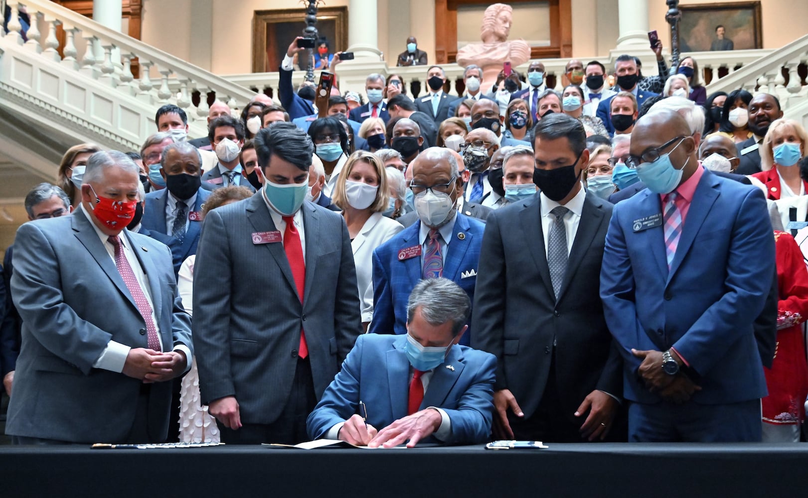 PHOTOS: Gov. Kemp signs hate-crimes bill on last day of legislative session