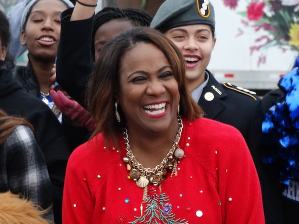 Karyn Greer with her Christmas sweater during the Can-a-Thon for the Salvation Army. CREDIT: Rodney Ho/rho@ajc.com