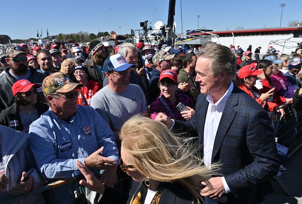 March 26, 2022 Commerce - David Perdue walks in during a rally for Georgia GOP candidates at Banks County Dragway in Commerce on Saturday, March 26, 2022. (Hyosub Shin / Hyosub.Shin@ajc.com)