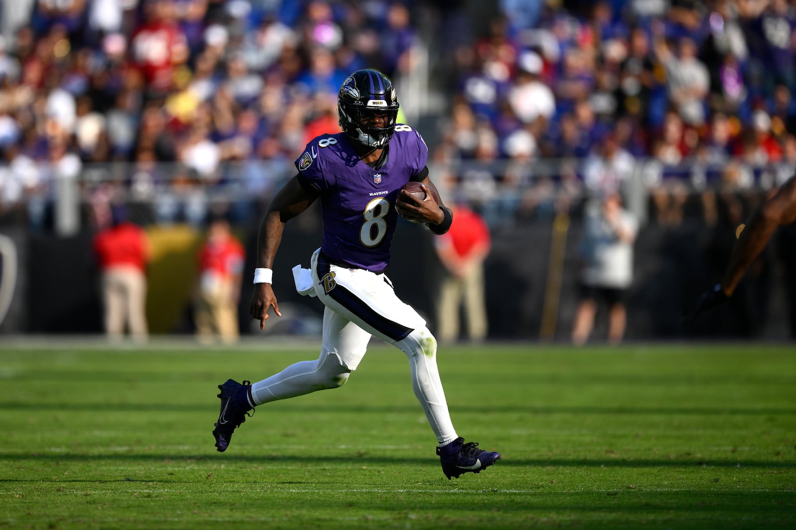 Baltimore Ravens quarterback Lamar Jackson scrambles during the second half of an NFL football game against the Washington Commanders Sunday, Oct. 13, 2024, in Baltimore. (AP Photo/Nick Wass)