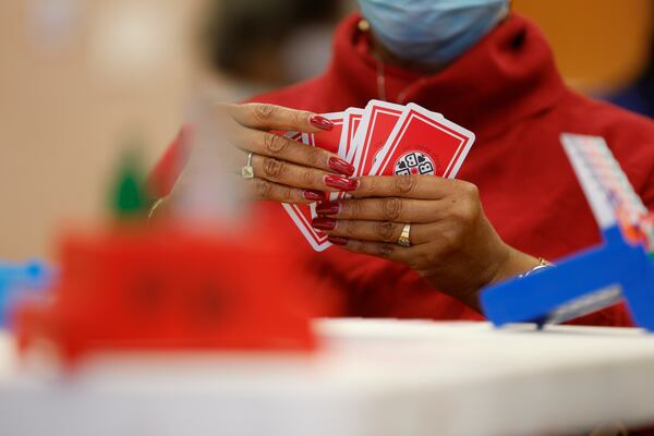 Members of the University Bridge Club meet for their weekly game at Quality Living Services in Atlanta. (Natrice Miller/natrice.miller@ajc.com) 