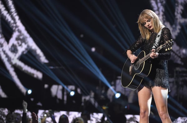  Taylor tones it down with an acoustic set. (Photo by Kevin Winter/Getty Images for DIRECTV)