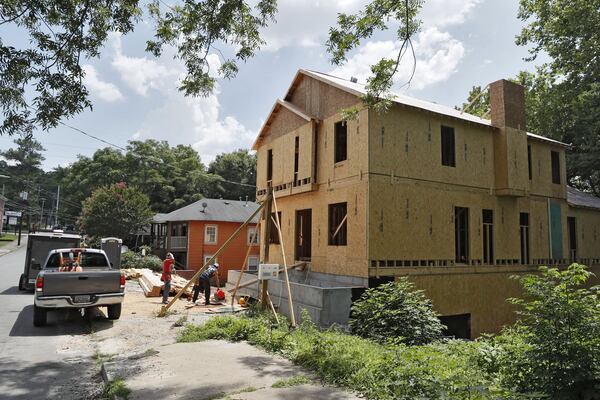 Vine City, poor and African American for close to 100 years, is beginning to see new construction and rising home and rent prices as the area begins to gentrify. The changes have added to concerns from residents about their futures. Bob Andres / bandres@ajc.com