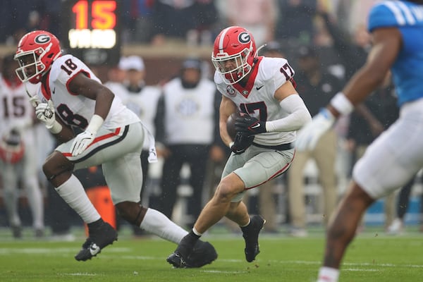 Georgia defensive back Dan Jackson (17) runs the ball after making an interception during the first half of an NCAA college football game against Mississippi on Saturday, Nov. 9, 2024, in Oxford, Miss. (AP Photo/Randy J. Williams)