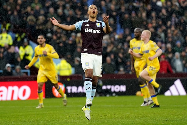 Aston Villa's Youri Tielemans reacts after his penalty is saved by Crystal Palace goalkeeper Dean Henderson during the English Premier League soccer match between Aston Villa and Crystal Palace, at Villa Park, Birmingham, England, Saturday Nov. 23, 2024. (Jacob King/PA via AP)