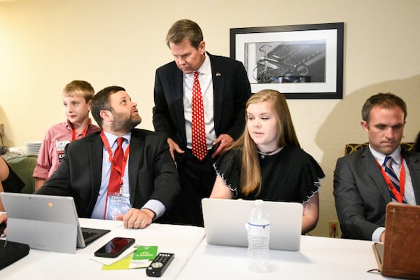 Tim Fleming chats with Gov. Brian Kemp as they monitor election results in May 2018. (AP Photo/John Amis)