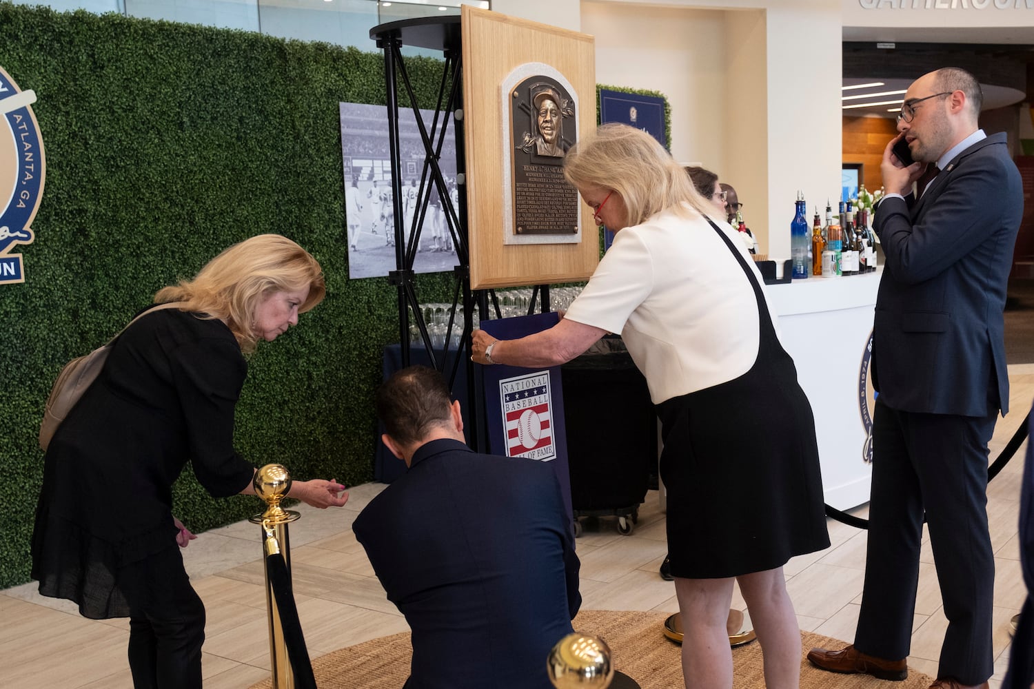 A display with Hank Aaron's Hall of Fame plaque is set up in the foyer of the Atlanta History Center during the opening of the "More Than Brave: The Life of Henry Aaron" exhibit on Monday, April 8, 2024. (Ben Gray / Ben@BenGray.com)