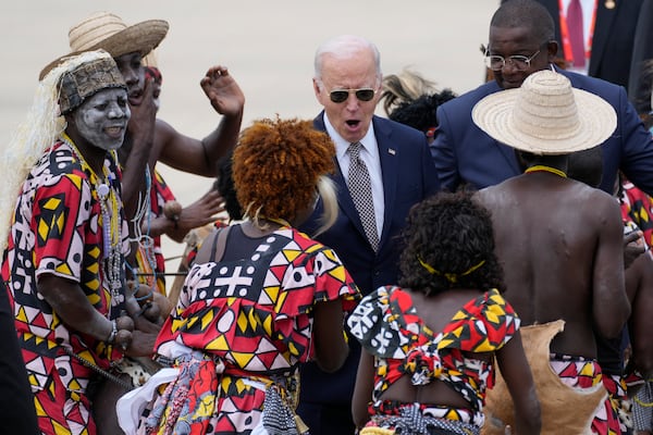 President Joe Biden watches a traditional dance after arriving at Catumbela airport in Angola on Wednesday, Dec. 4, 2024. (AP Photo/Ben Curtis)