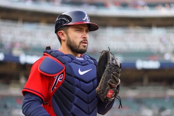 Atlanta Braves catcher Travis d’Arnaud walks onto the field to warms-up before their game against the Philadelphia Phillies at Truist Park, Friday, May 26, 2023, in Atlanta. (Jason Getz / Jason.Getz@ajc.com)