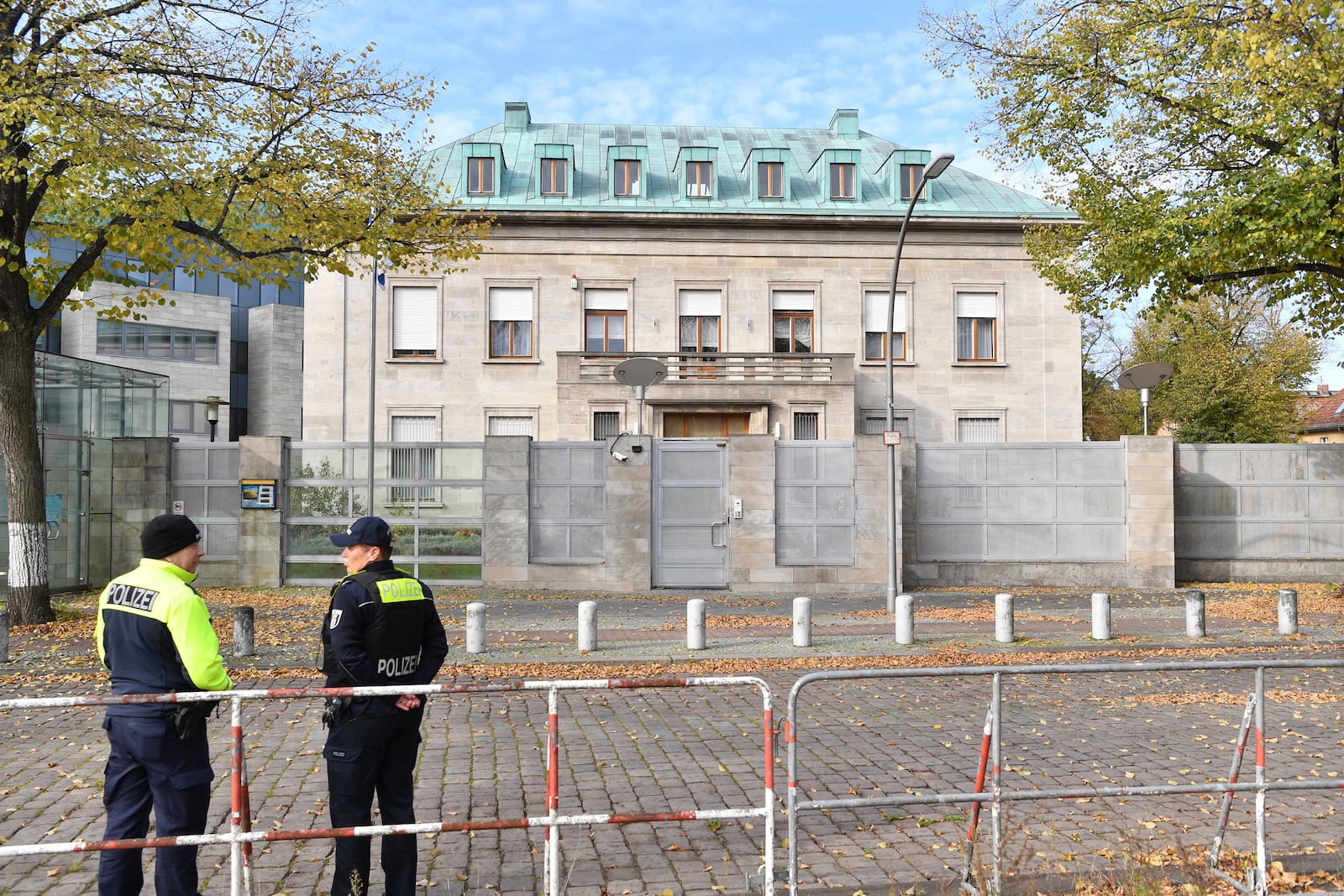 Police officers stand by the Israeli embassy in Berlin, Sunday, Oct. 20, 2024. (Paul Zinken/dpa via AP)