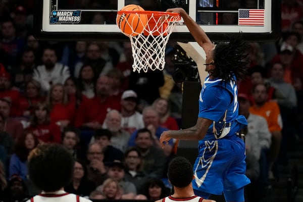 Creighton guard Jamiya Neal (5) dunks against Louisville during the second half in the first round of the NCAA college basketball tournament, Thursday, March 20, 2025, in Lexington, Ky. (AP Photo/Brynn Anderson)