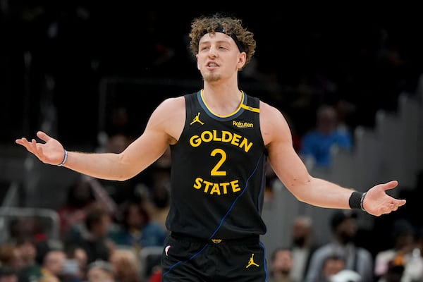 Golden State Warriors guard Brandin Podziemski (2) speaks on the court during the first half of an NBA basketball game against the Golden State Warriors, Saturday, March 22, 2025, in Atlanta. (AP Photo/Mike Stewart)