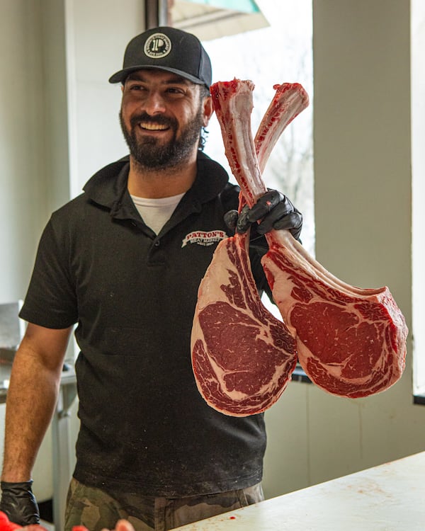 Meat cutter Ardy Moshkelani shows off his work at Patton's Meat Market in Duluth. (Courtesy of Aaliyah Man)