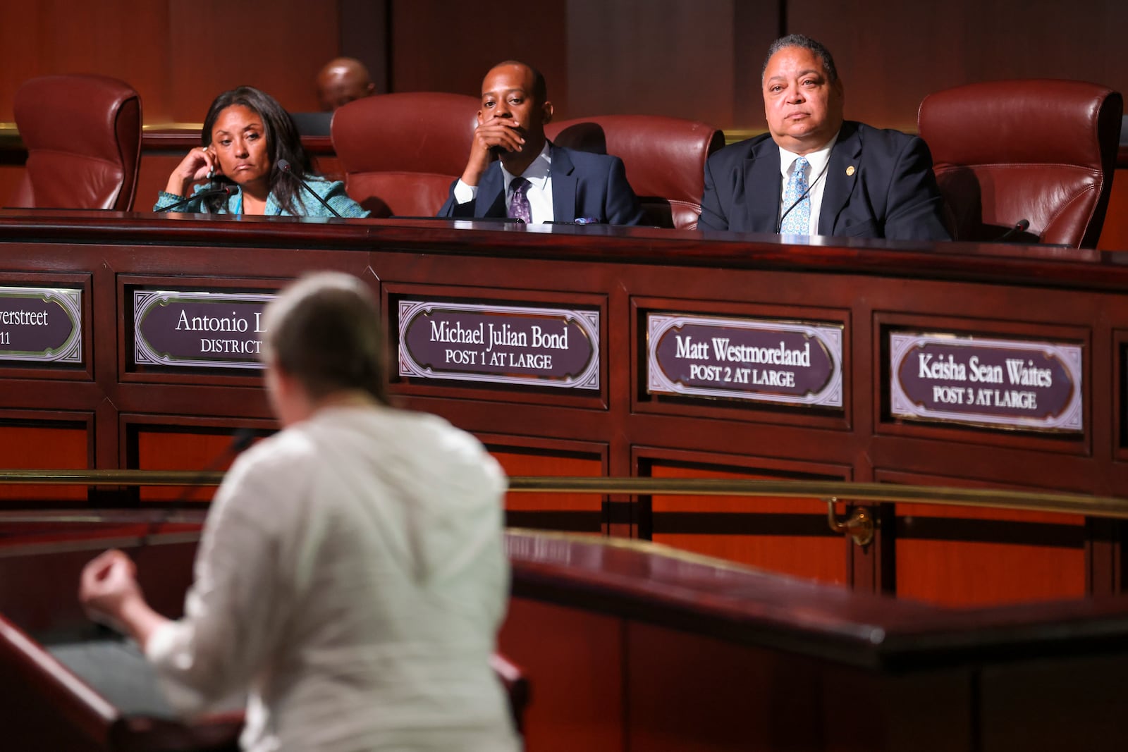 Council members listen to a member of the public as she speaks in opposition to the planned Police Training Center at Atlanta City Hall ahead of the final vote to approve legislation to fund the training center on Monday, June 5, 2023, in Atlanta. (Jason Getz/The Atlanta Journal-Constitution)