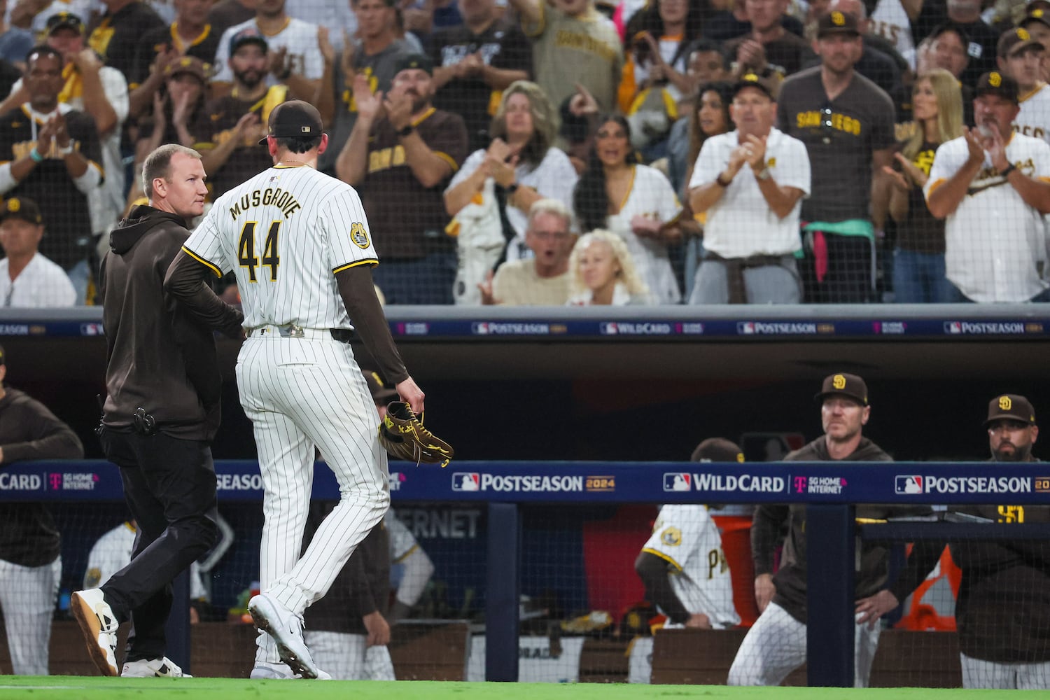 San Diego Padres pitcher Joe Musgrove exits the field with an apparent injury against the Atlanta Braves during the fourth inning of National League Division Series Wild Card Game Two at Petco Park in San Diego on Wednesday, Oct. 2, 2024.   (Jason Getz / Jason.Getz@ajc.com)