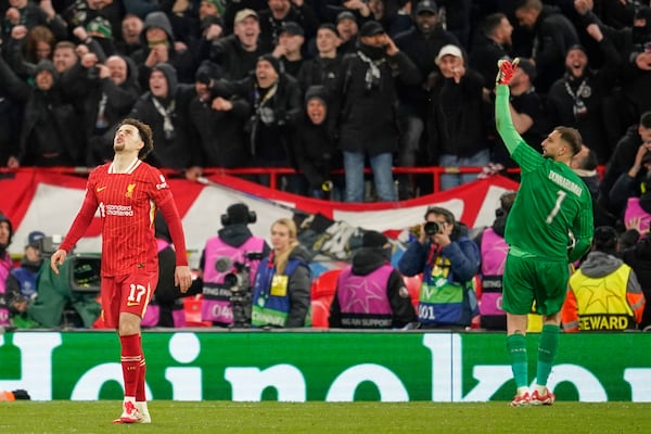 PSG's goalkeeper Gianluigi Donnarumma reacts after saving a penalty from Liverpool's Curtis Jones during a shootout at the end of the Champions League round of 16 second leg soccer match between Liverpool and Paris Saint-Germain at Anfield in Liverpool, England, Tuesday, March 11, 2025. (AP Photo/Dave Thompson)