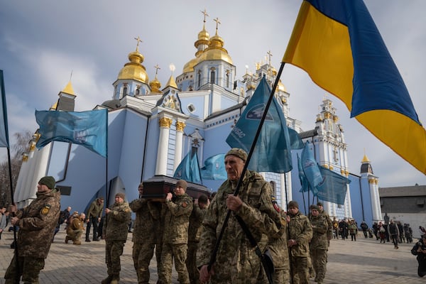 Servicemen carry the coffin of Ukrainian soldier Vasyl Ratushnyy, 28 during the funeral ceremony in St. Michael Cathedral in Kyiv, Ukraine, Wednesday, March 5, 2025. (AP Photo/Efrem Lukatsky)