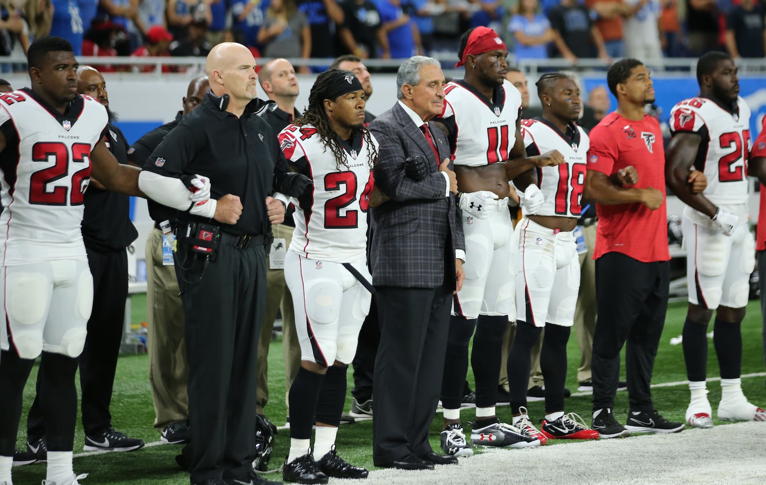 Photos: Falcons show solidarity during National Anthem